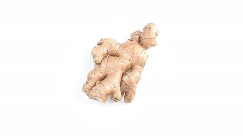 Rotating Ginger Root Against a White Background
