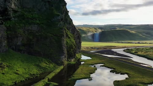 Panoramic Aerial Drone View of Majestic Icelandic Waterfalls and Greenery