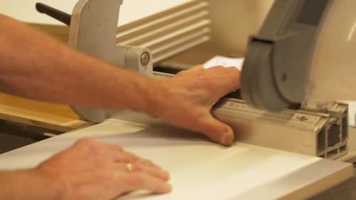 Man Using a Table Saw to Cut Wood