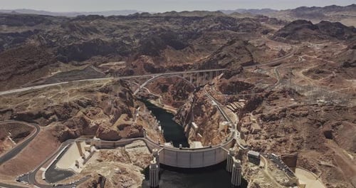 Hoover Dam Nevada Aerial v18 birds eye view flyover rugged desert terrain capturing concrete dam