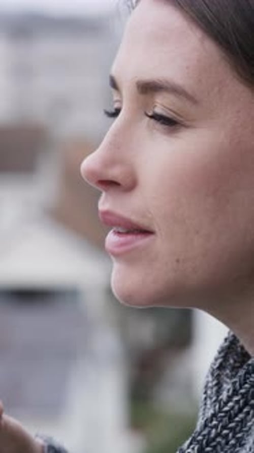 Woman, thinking and balcony with coffee in city for morning beverage, start or ambition in home