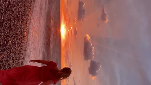 A Happy Girl at Sunset By the Sea