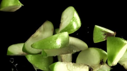 Pieces of Green Apples Fly Up and Fall Down Filmed on a Highspeed Camera at 1000 Fps