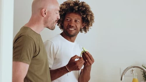 Two Men Enjoying a Healthy Avocado Snack
