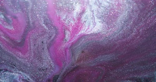Sparkling Paint Swirls Together Creating Abstract Texture