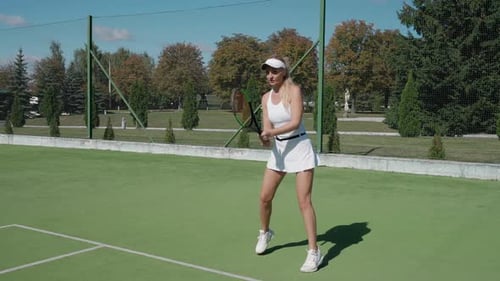 Woman Tennis Player Ready to Hit the Ball