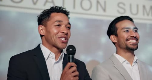 Men Speaking at Innovation Summit Event