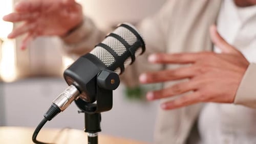 Microphone, platform and podcast with hands of influencer in recording studio for live radio