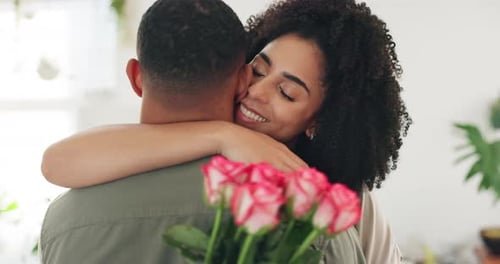 Woman Embraces Man Holding Pink Roses