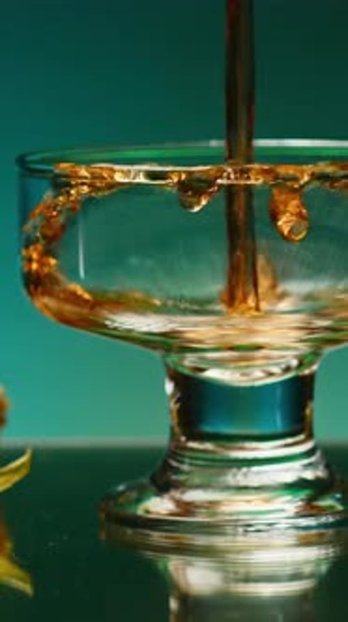 A Bright Illuminated Still Life Stock Clip A Beautiful Roomy Mug in Which Brandy is Poured and Small