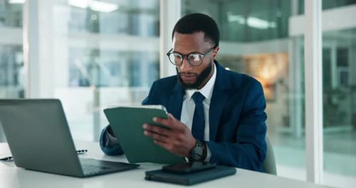 Laptop, tablet and black man in office with research for finance report with budget planning