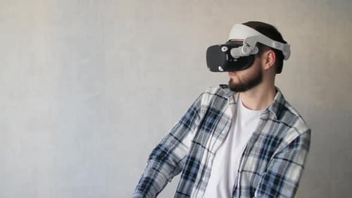 Man Immersed in Virtual Reality with Headset