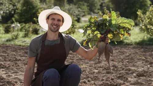 Portrait of Successful Happy Farmer with Bunch of Beets in Hands Slow Motion