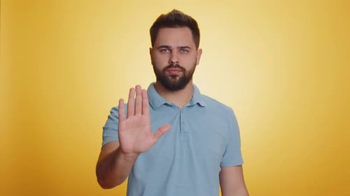 Young Man Say No Hold Palm Folded Crossed Hands in Stop Gesture Warning of Finish Prohibited Access