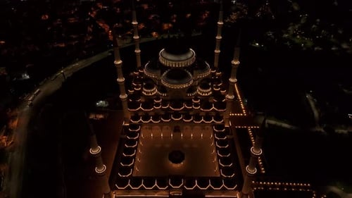 Aerial view of grand mosque illuminated at night, Turkey.