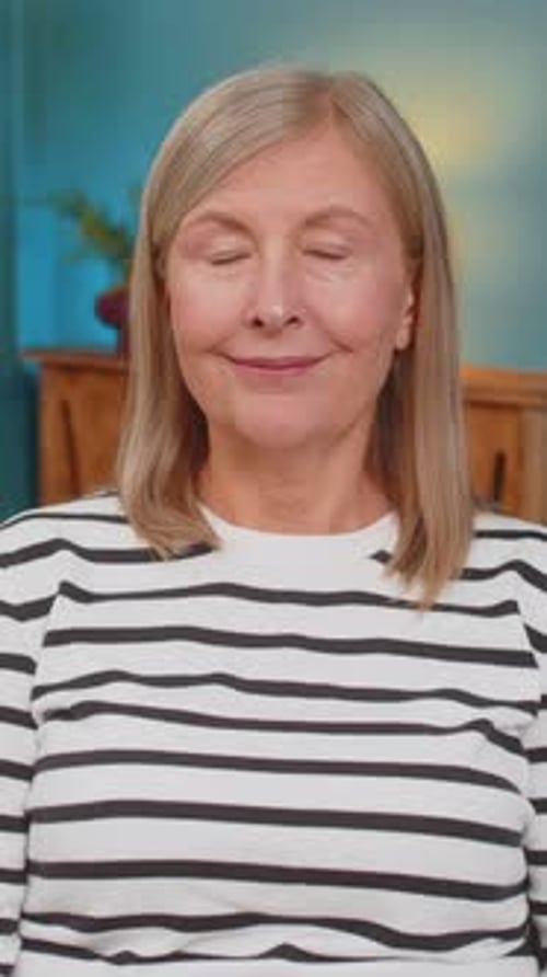 Smiling Woman with Blonde Hair in Interior Setting