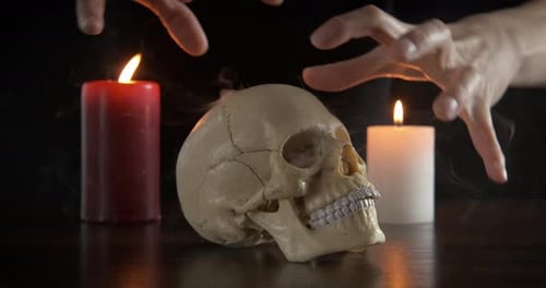 Skull and Candles with Spellcasting Hands