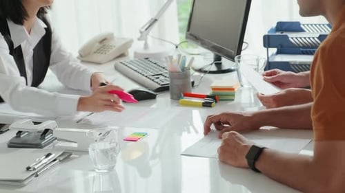 Financial Consultant Meeting with Client in Office