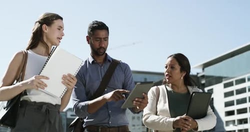 Walking, tablet and business people in city with documents on morning commute