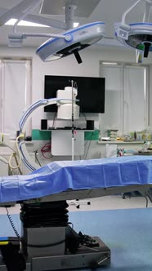 Well-equipped surgery room with no doctors or patients.