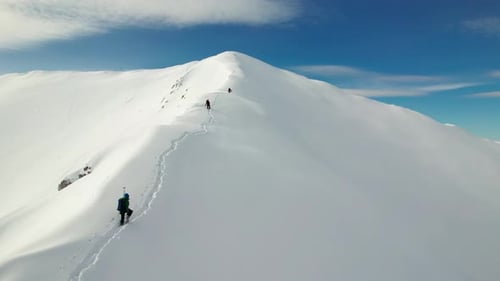 Trekking to the Summit of La Om Peak amidst the snowy splendor of the Piatra Craiului Mountains in w