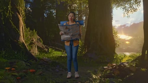 Asian Female Hiker Looking At The Map Then Looking Around While Exploring Forest Nature