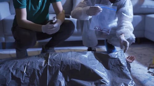 Investigators Examine Evidence at Indoor Crime Scene