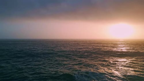 Amazing Orange Coastal Sunset Over Ocean Waves Aerial Sea Reflecting Sundown