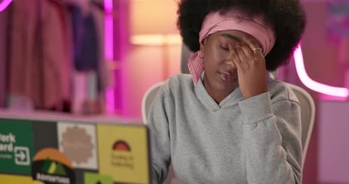 Girl, laptop and stress at night for distance learning, headache or tired with test for fashion