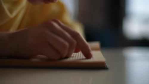 Child Reading Book with Finger Tracking Text