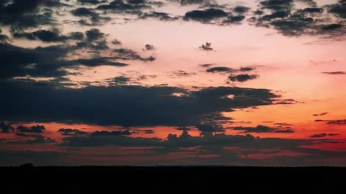 Majestic Sunset with Clouds and Silhouetted Horizon