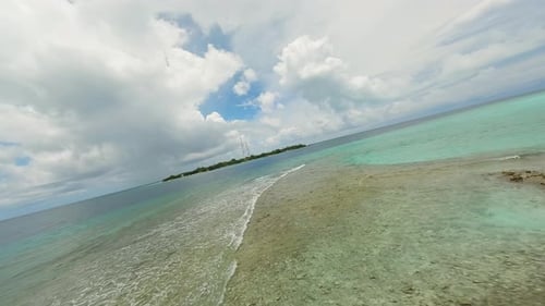 Flying Over the Water Surface in the Maldives