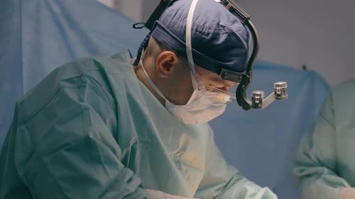 Man Surgeon in Medical Uniform Doctor Practitioner Healthcare Worker Medic Physician Perform