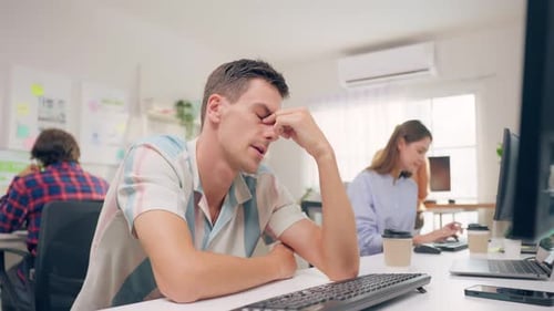 Man at Desk, Thoughtful, Workplace Environment