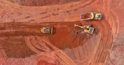 Heavy Machinery Working in Red Dirt Environment
