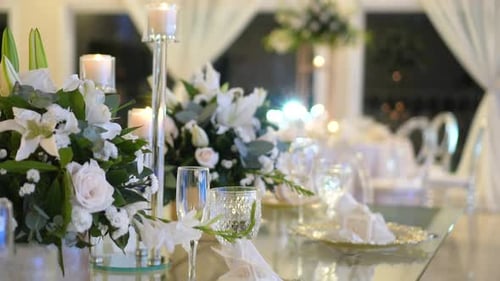 Elegant Wedding Table with Floral Arrangements and Candles
