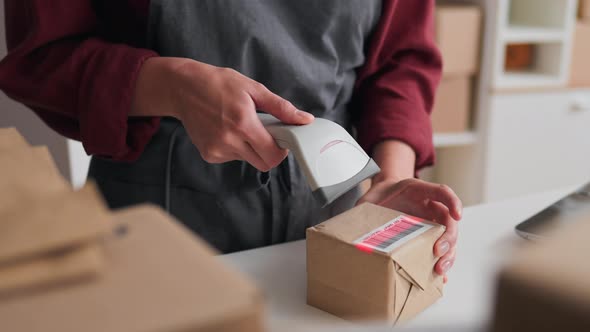 Close Up Of The Process Of Scanning A Box With A Barcode Of Packed ...