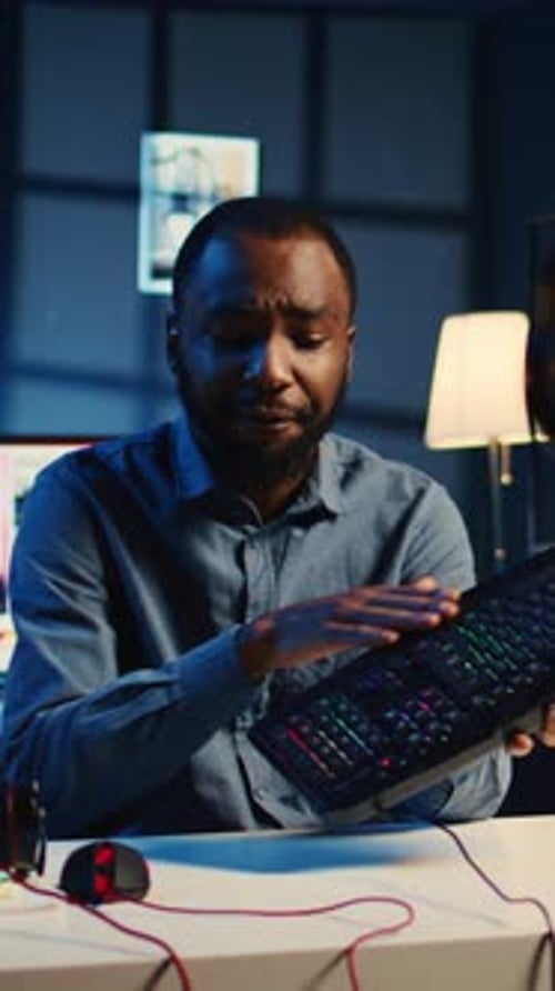 Vertical Video Man Reviews Keyboard in Apartment Studio