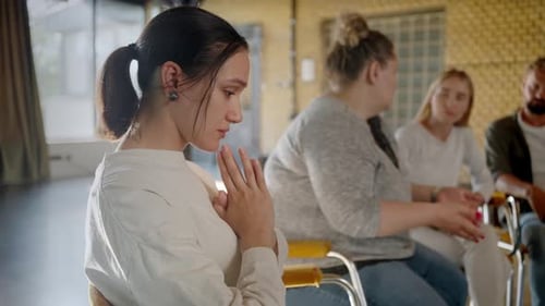 Lady in Grief Sitting in Circle of Therapeutic Meeting
