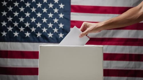 Envelope Being Placed Into White Ballot Box
