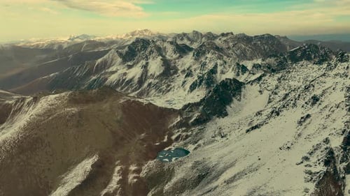 Snowy High Mountains and Sunset