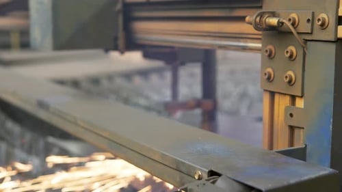 Industrial Machine Cutting Metal with Sparks
