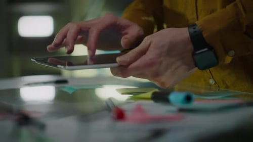 Adult Using a Tablet at Office Desk