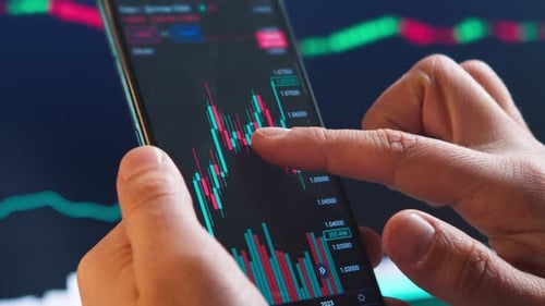 Businessman Hand Holding Phone and Analysis Finance Market Graph Stock Market