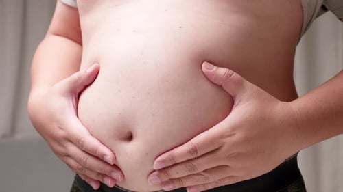 Close Up of Man Holding Stomach