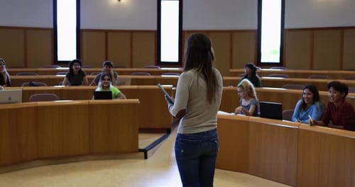 Teacher Working with Students Inside Classroom at School University Academic
