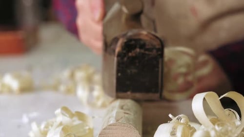 Hand Plane Smoothing Wood in Close Up Footage