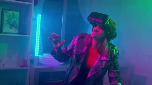 Young Adult Enjoys Virtual Reality Experience with VR Headset