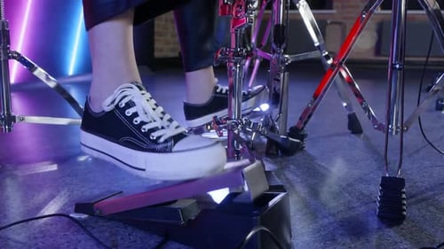 Drummer Using Bass Drum Pedal and Playing Snare Drum