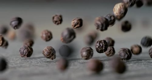 Peppercorns or black pepper spice. Super Macro Close Up. Shot on super slow motion camera 1000 fps.